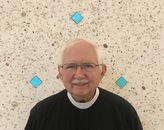 Canon Ernie Bennett, Priest in Charge